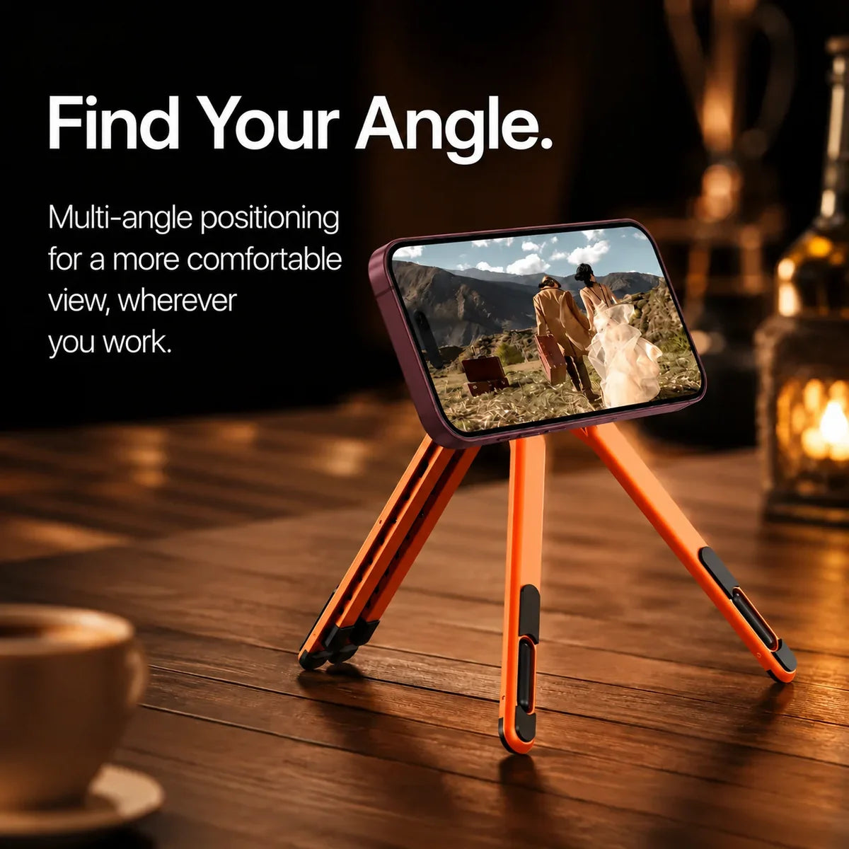 Cosmic Orange magnetic tripod stand holding a Burgundy iPhone displaying the original movie scene. #color_Cosmic Orange