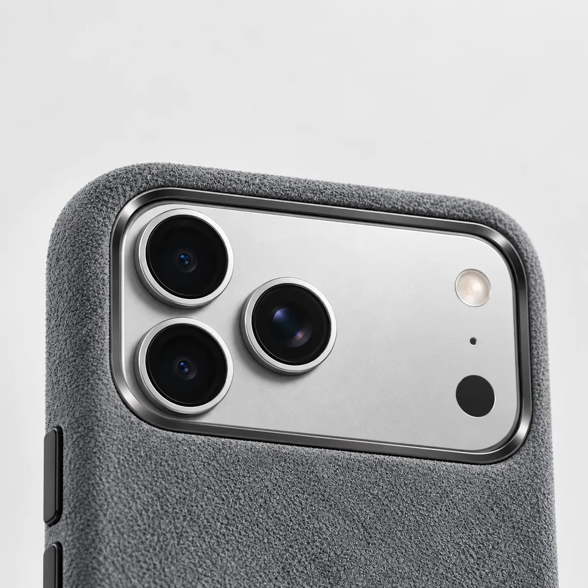 Gray fabric phone case with a polished gunmetal rim around a wide silver camera island.