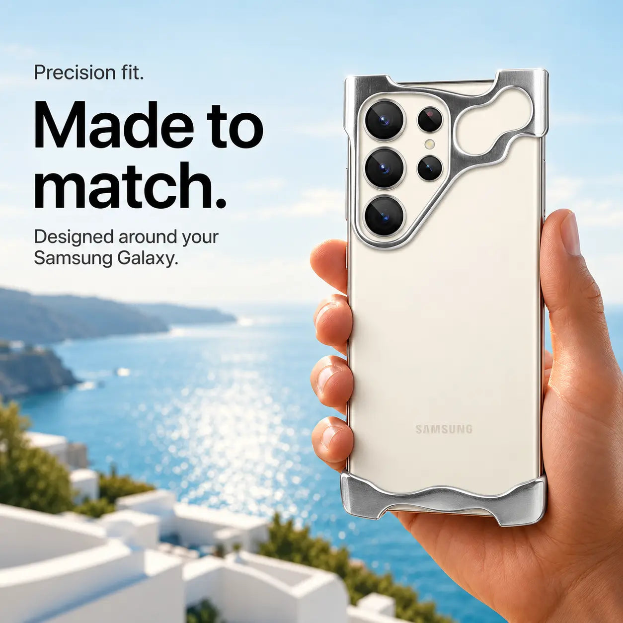 Silver open-edge phone case held in one hand above a coastal view #color_Silver