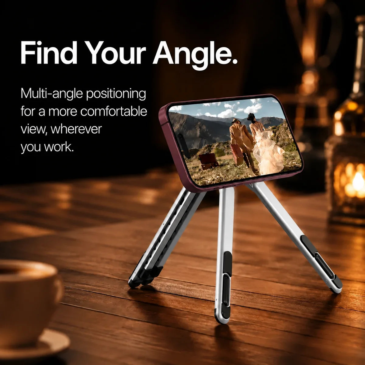 Titanium Silver magnetic tripod stand holding a Burgundy iPhone displaying the original movie scene. #color_Titanium Silver