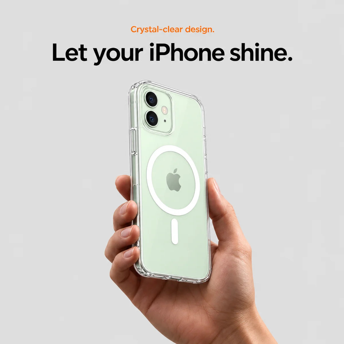 Clear magnetic phone case held at an angle, showing its transparent back and camera openings. #iPhone Model_iPhone 12