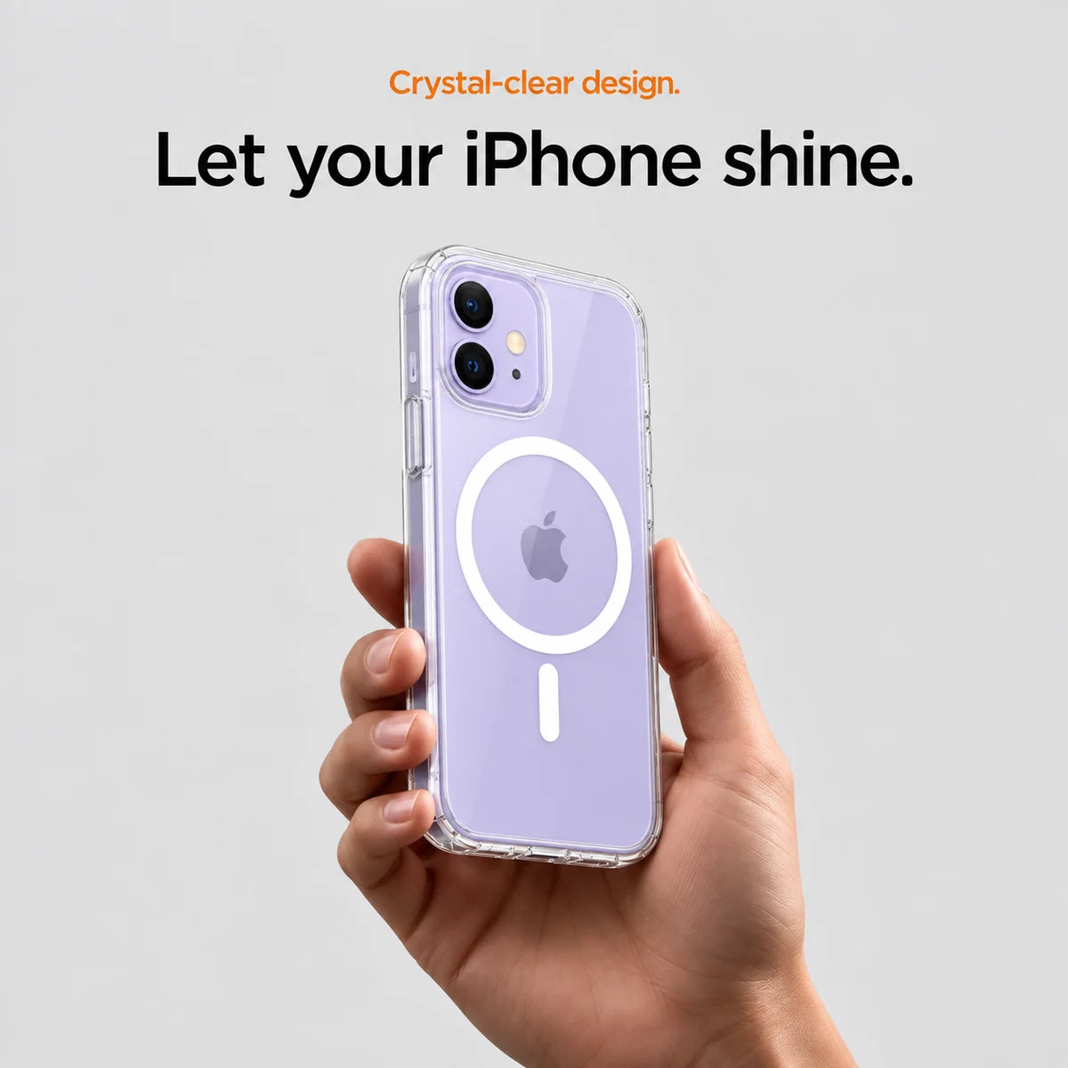 Clear magnetic phone case held at an angle, showing its transparent back and camera openings. #iPhone Model_iPhone 12 Mini