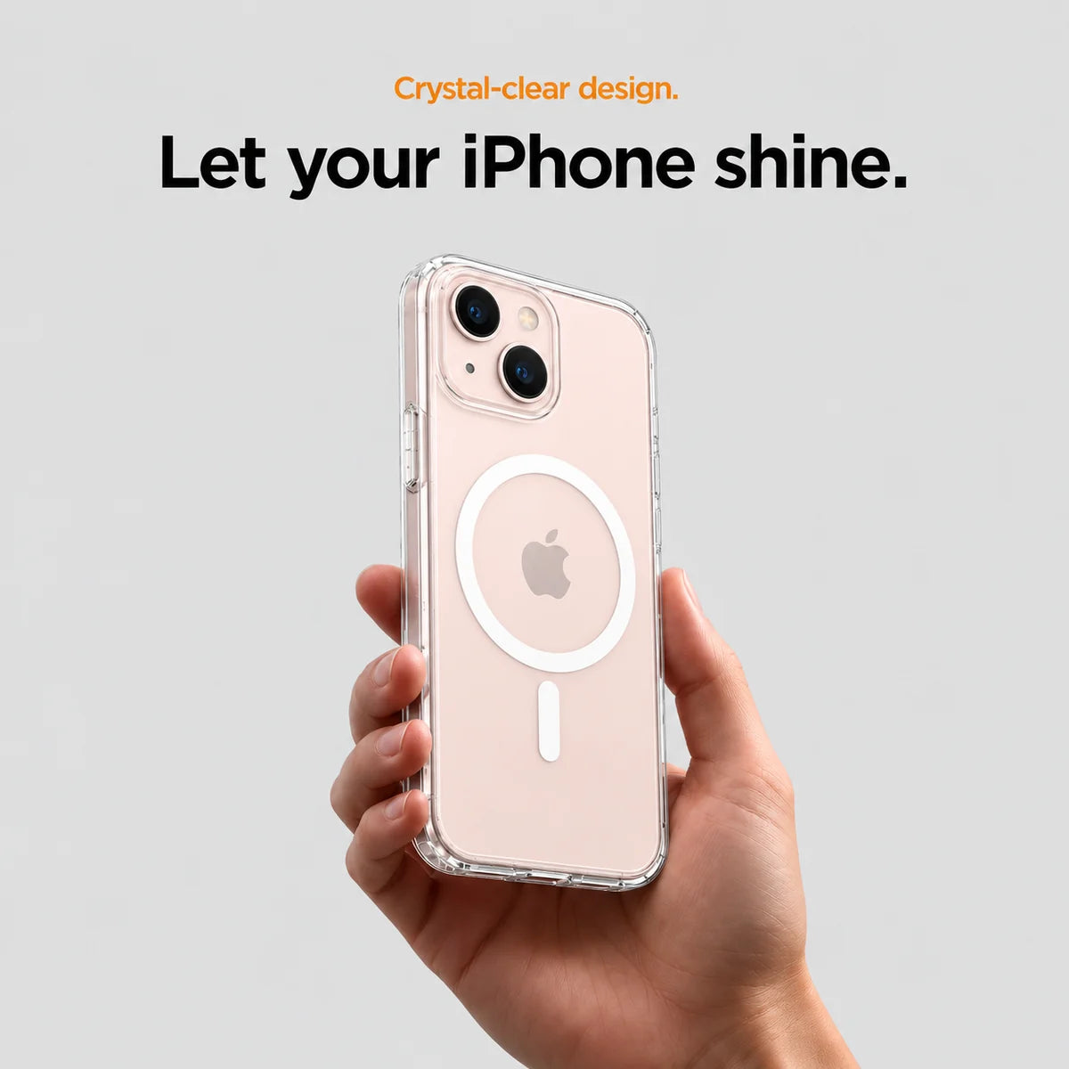 Clear magnetic phone case held at an angle, showing its transparent back and camera openings. #iPhone Model_iPhone 13