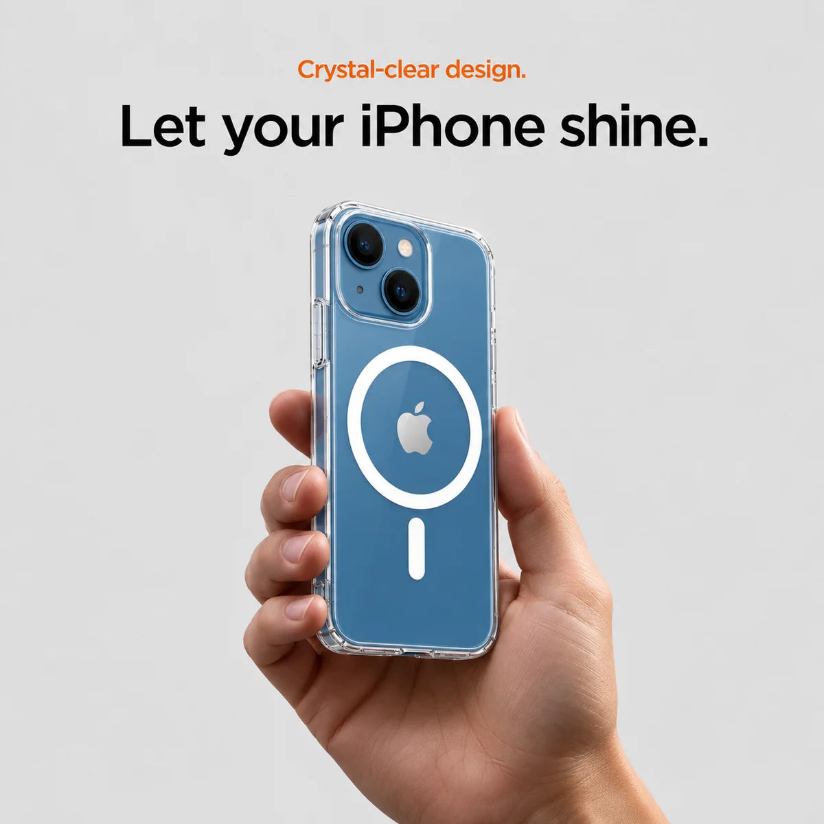 Clear magnetic phone case held at an angle, showing its transparent back and camera openings. #iPhone Model_iPhone 13 Mini
