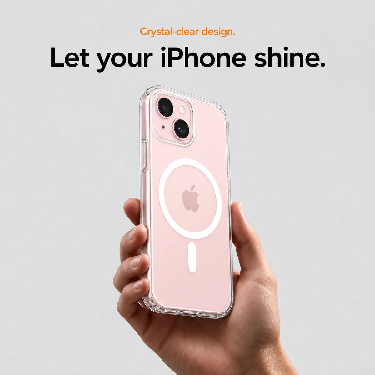Clear magnetic phone case held at an angle, showing its transparent back and camera openings. #iPhone Model_iPhone 15 Plus