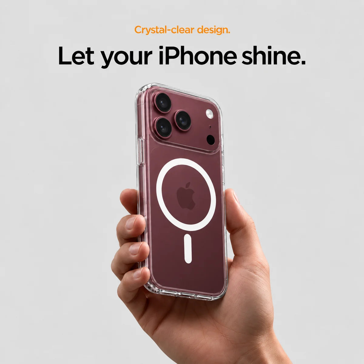 Clear magnetic phone case held at an angle, showing its transparent back and camera openings. #iPhone Model_iPhone 18 Pro