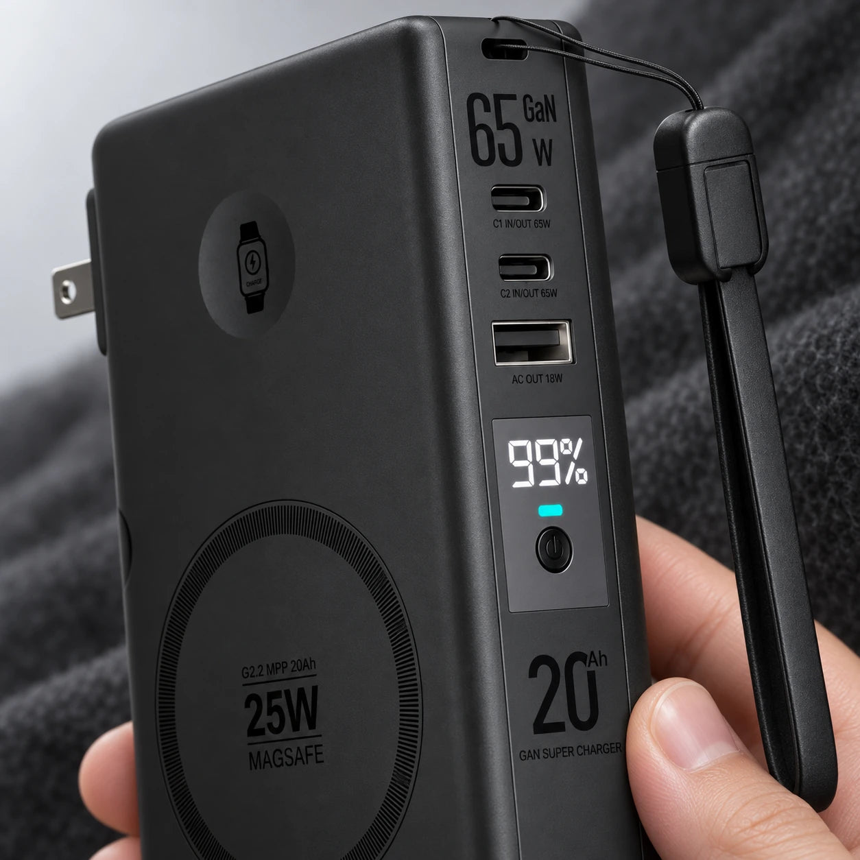 Close-up of the 99 percent charge display and power button on a black battery.