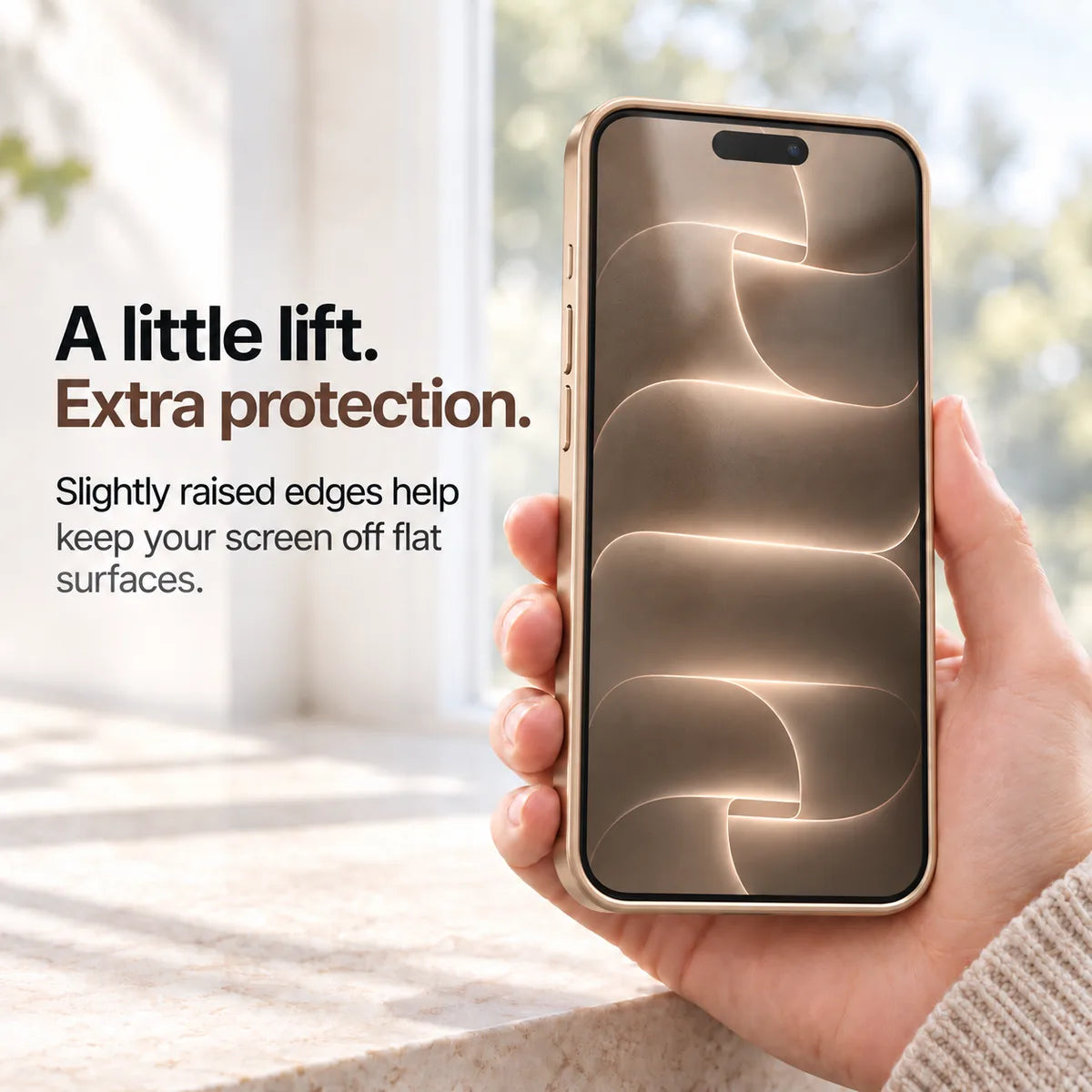 Desert gold metal phone case held with the front display and raised screen edges visible #color_Desert Gold