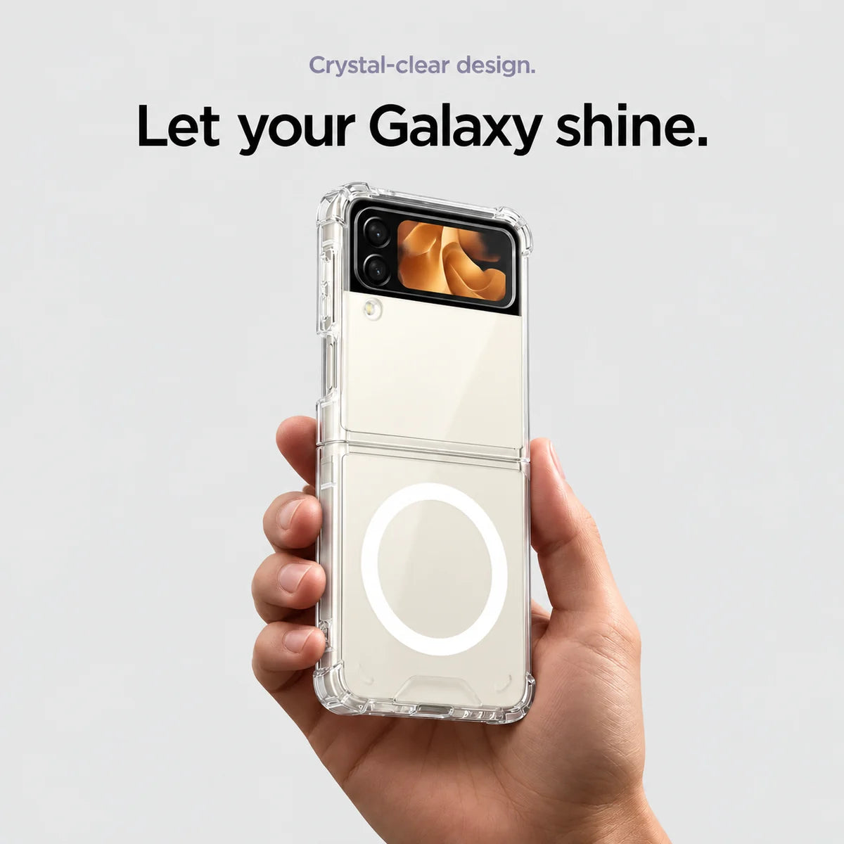 Clear magnetic phone case held at an angle, showing its transparent back and camera openings. #Samsung Model_Samsung Z Flip 3