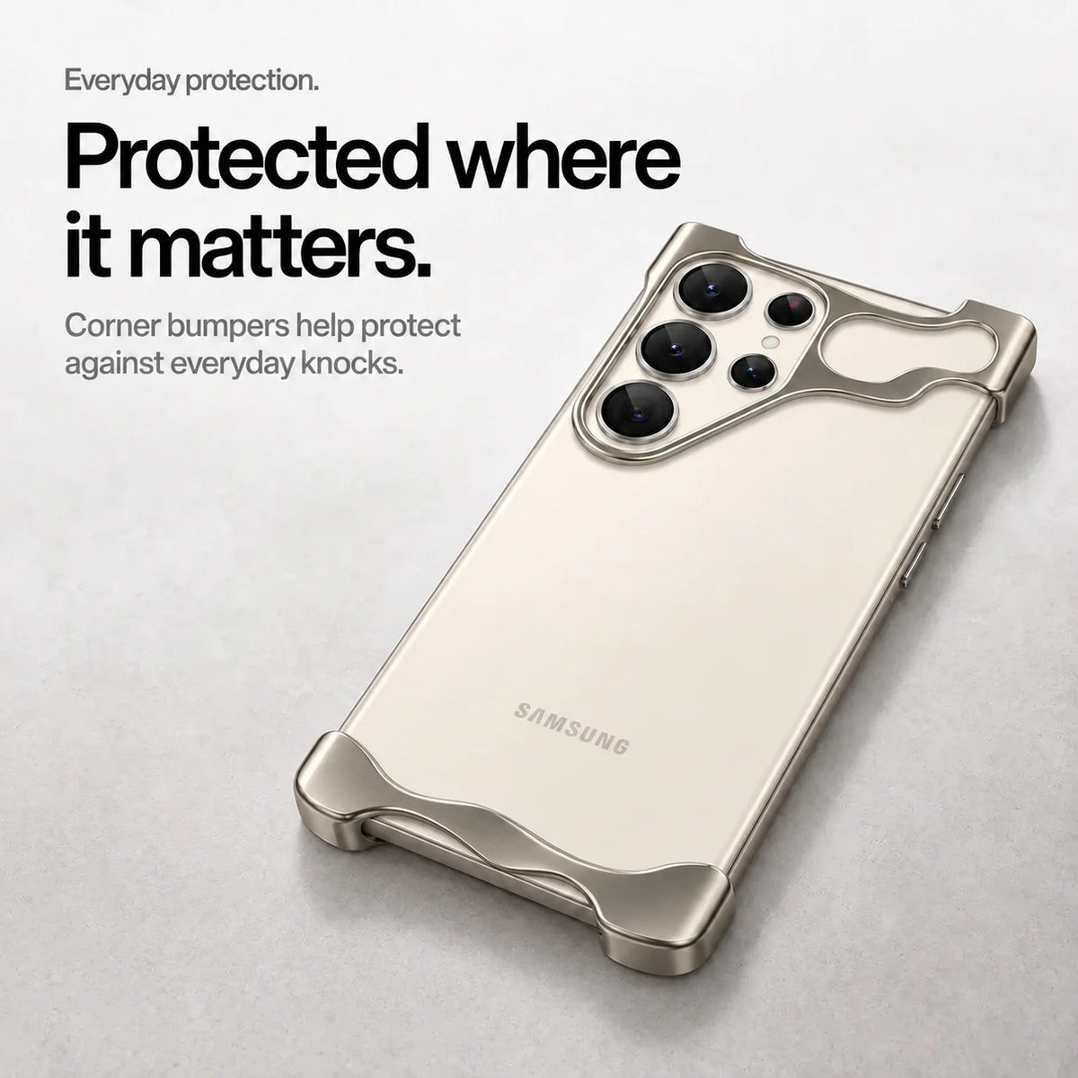 Gray open metal phone bumper case lying on a desk with raised corner protection #color_Gray