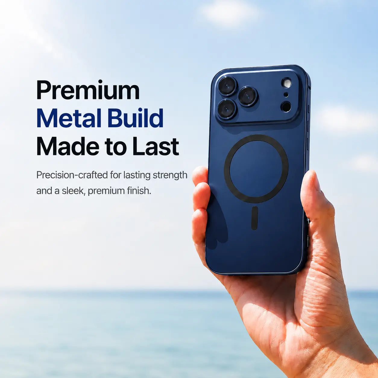 Navy blue metal magnetic phone case held upright beside the sea with a material feature caption #color_Deep Blue