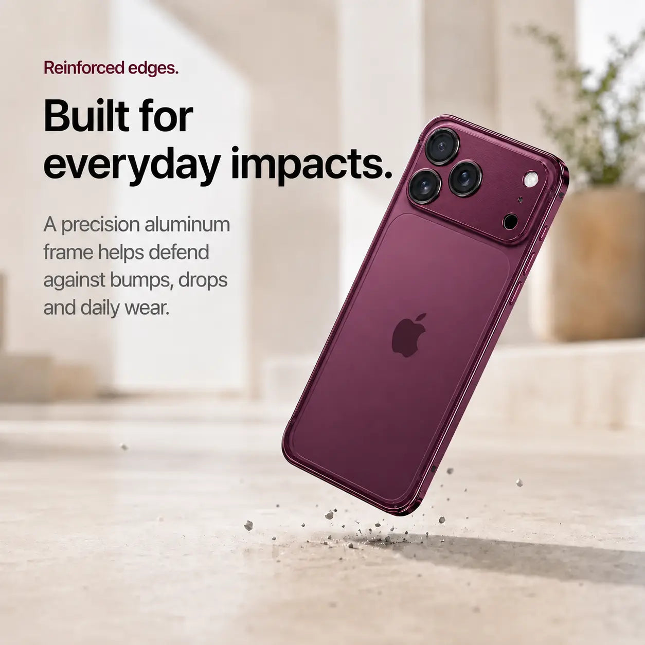 Burgundy aluminum bumper phone case shown during a corner drop demonstration #color_Cherry Red