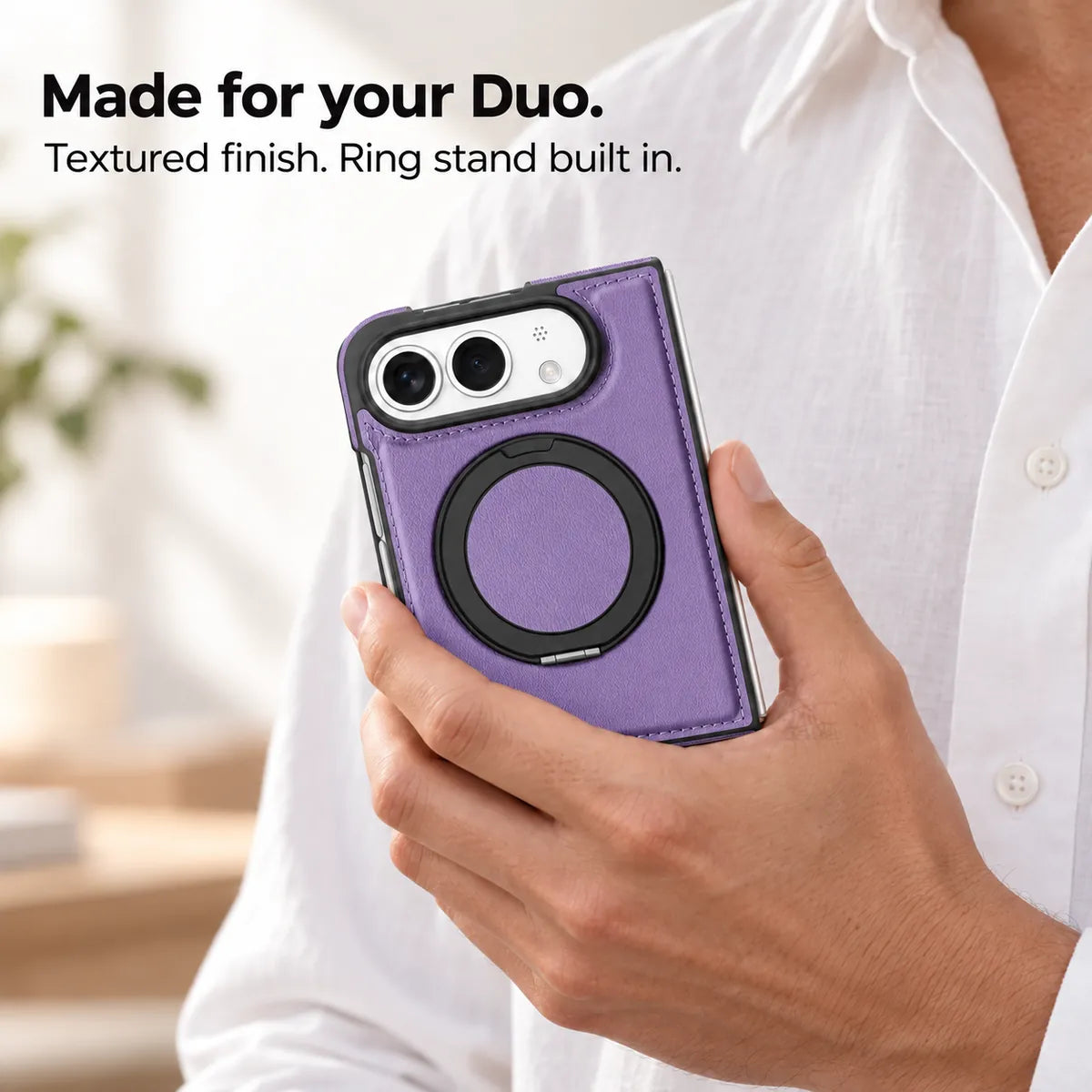 Hand holding a textured synthetic leather folding phone case with the ring stand folded flat. #color_Soft Purple