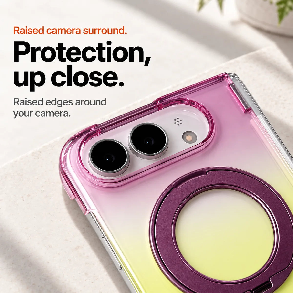Purple and yellow gradient phone case close-up showing the raised oval camera surround and folded ring. #color_Orchid Glow