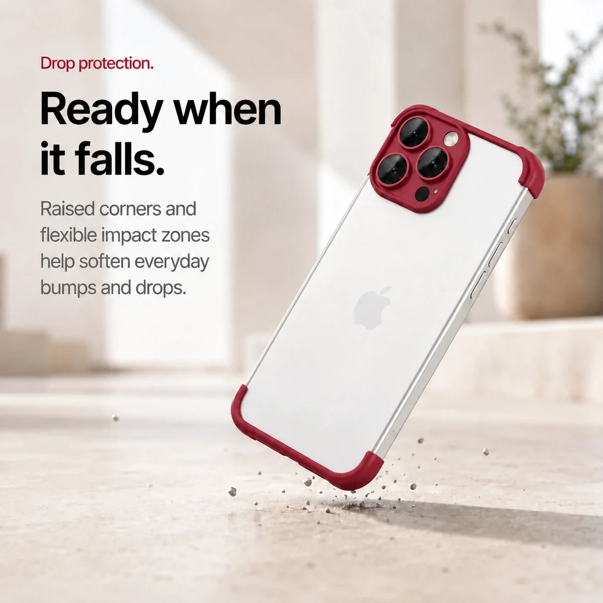 Red phone bumper shown landing on a protected corner above a stone surface #color_Crimson Red